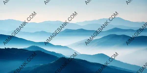 Embracing the Mist: Majestic Mountain Range in Captivating Haze