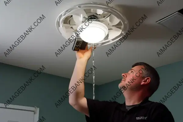 Electric Worker Installing Ceiling Light Fixture with Precision